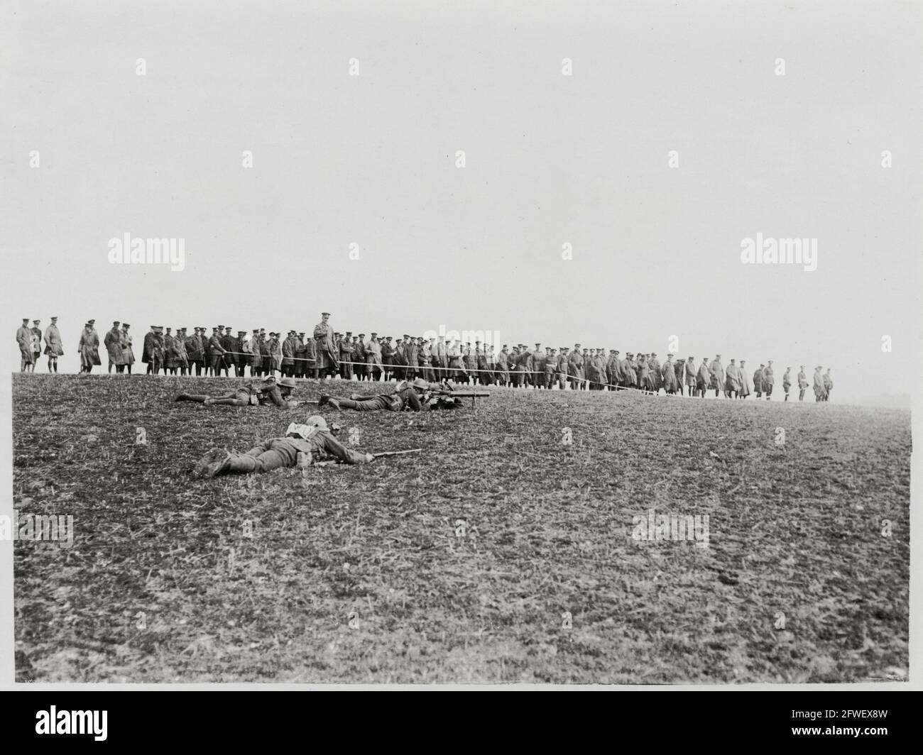 World War One, WWI, Western Front - Officers watch a machine-gun demonstration in a field, France Stock Photo