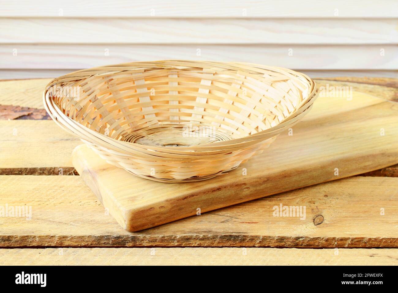 Empty wicker basket on wooden table. Graphic resources Stock Photo