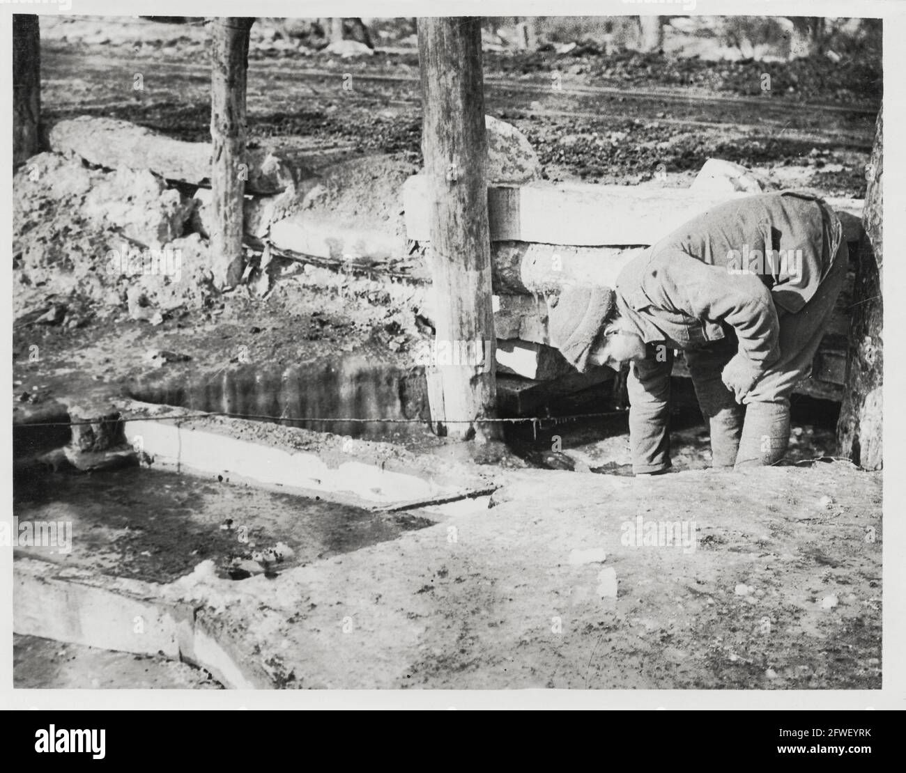 World War One, WWI, Western Front - A Royal Engineer searches for water holes in the ice, France Stock Photo