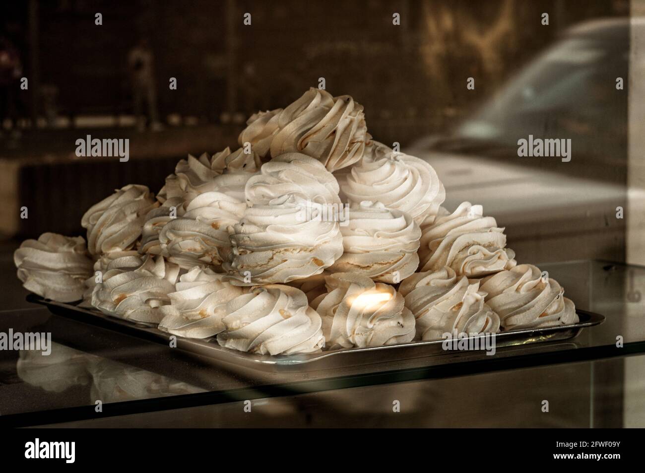 Fresh marshmallow on the shopwindow of bakerie conditoria Stock Photo