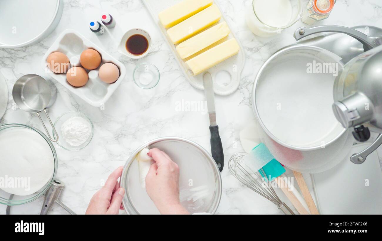 Step by step. Flat lay. Greasing cake pans with butter to bake a three