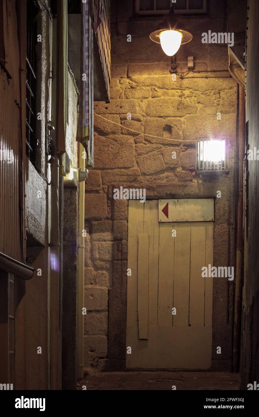 An old alley by night from historic Porto, Portugal Stock Photo