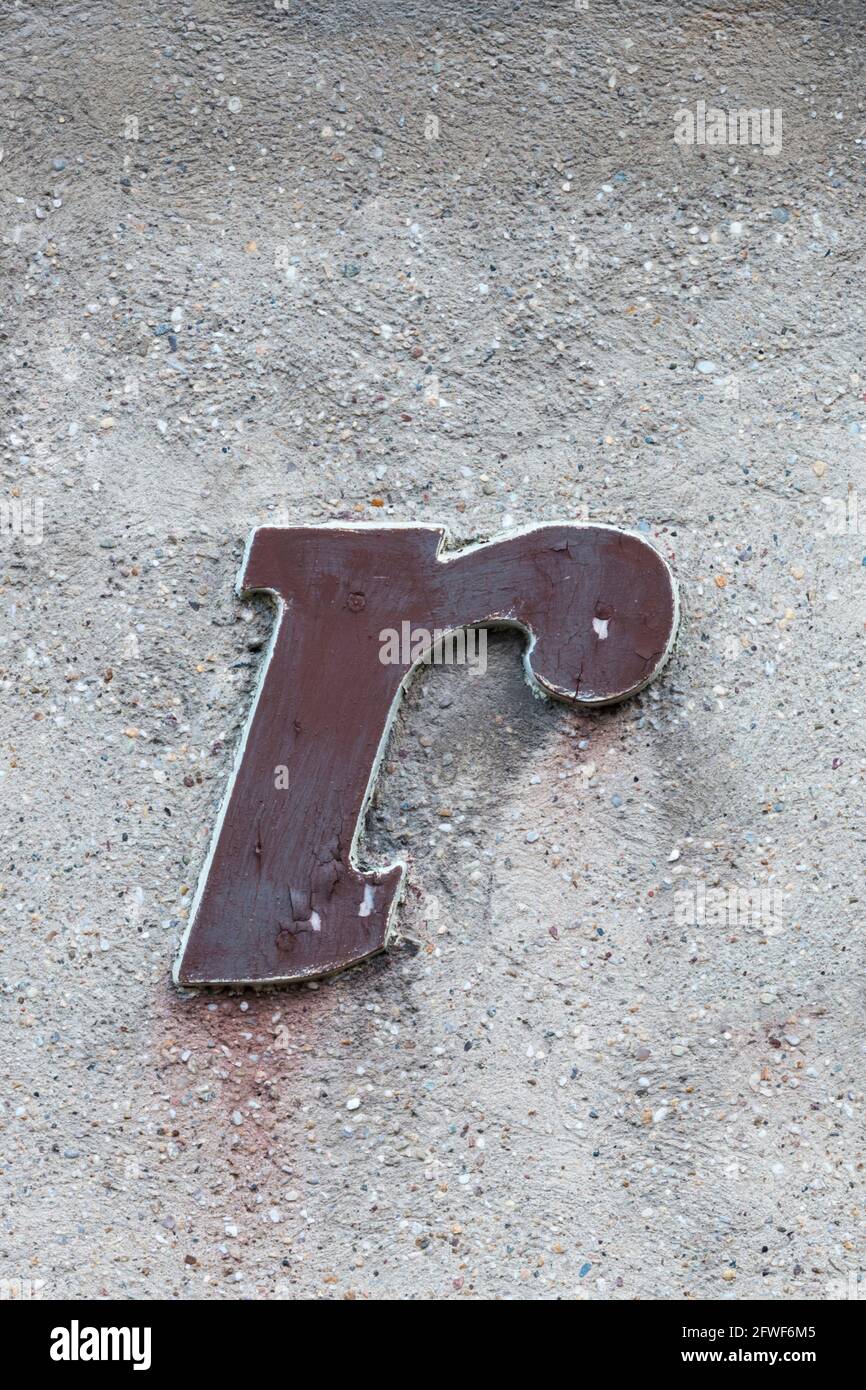 Historical letter r of an advertising typeface in red-brown Stock Photo