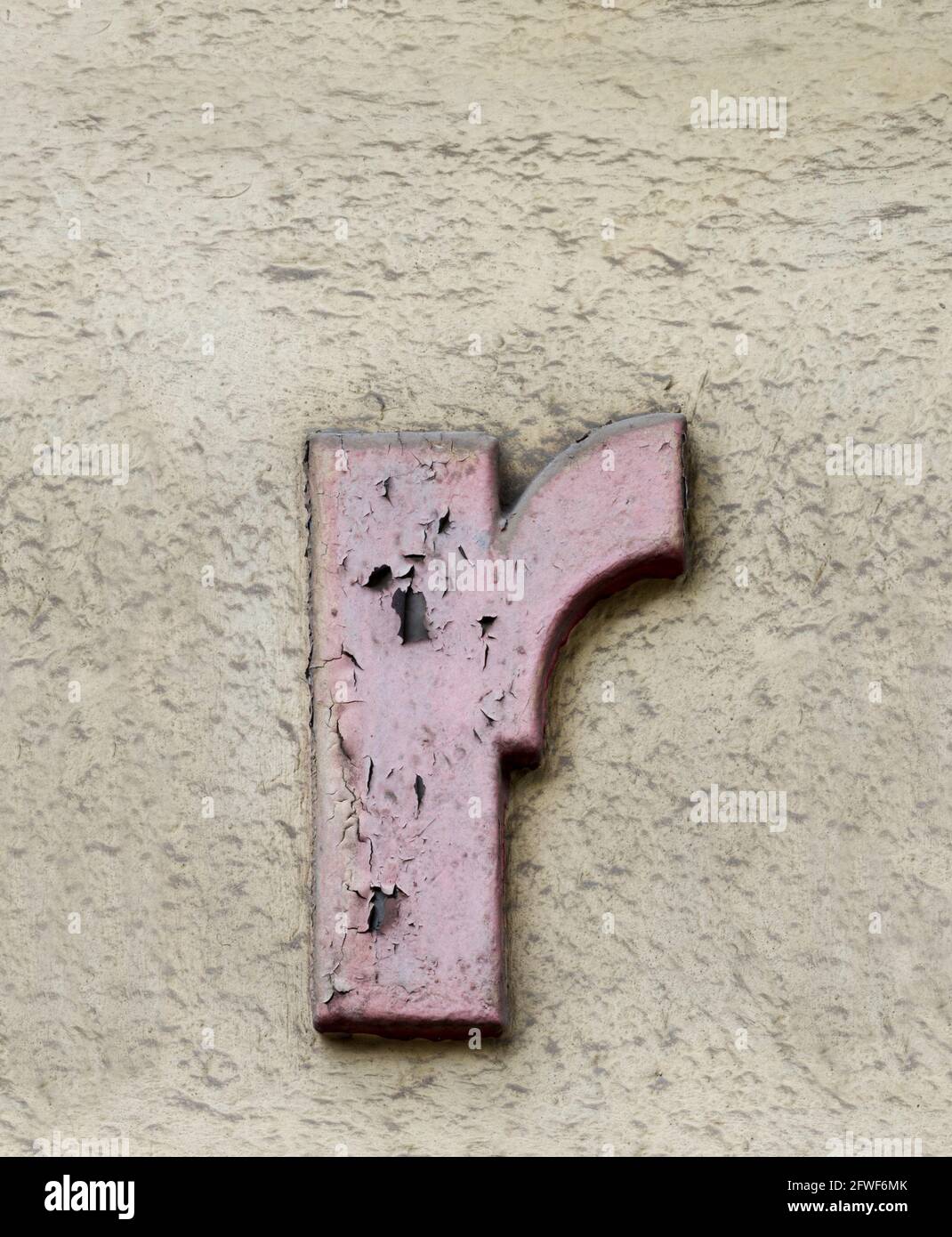 A lowercase r in faded pink Stock Photo