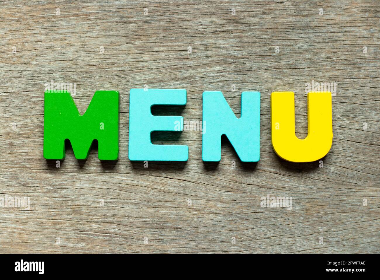 Color alphabet letter in word menu on wood background Stock Photo - Alamy