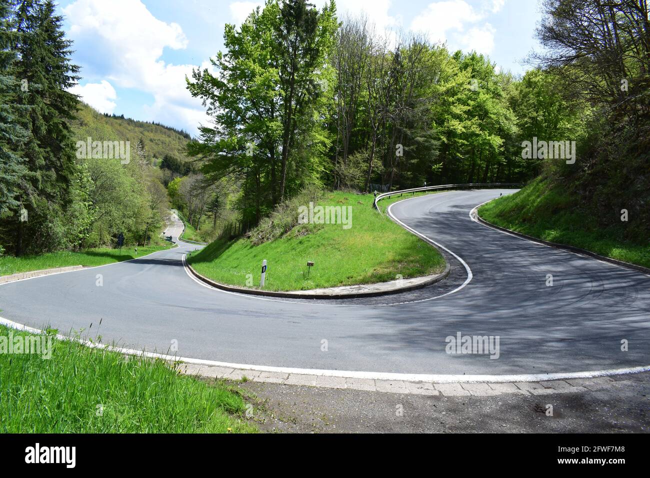 twisted Eifel road in spring Stock Photo
