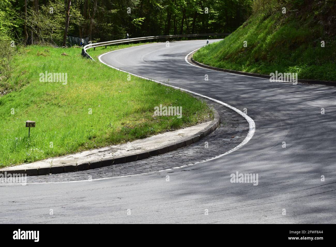 twisted Eifel road in spring Stock Photo