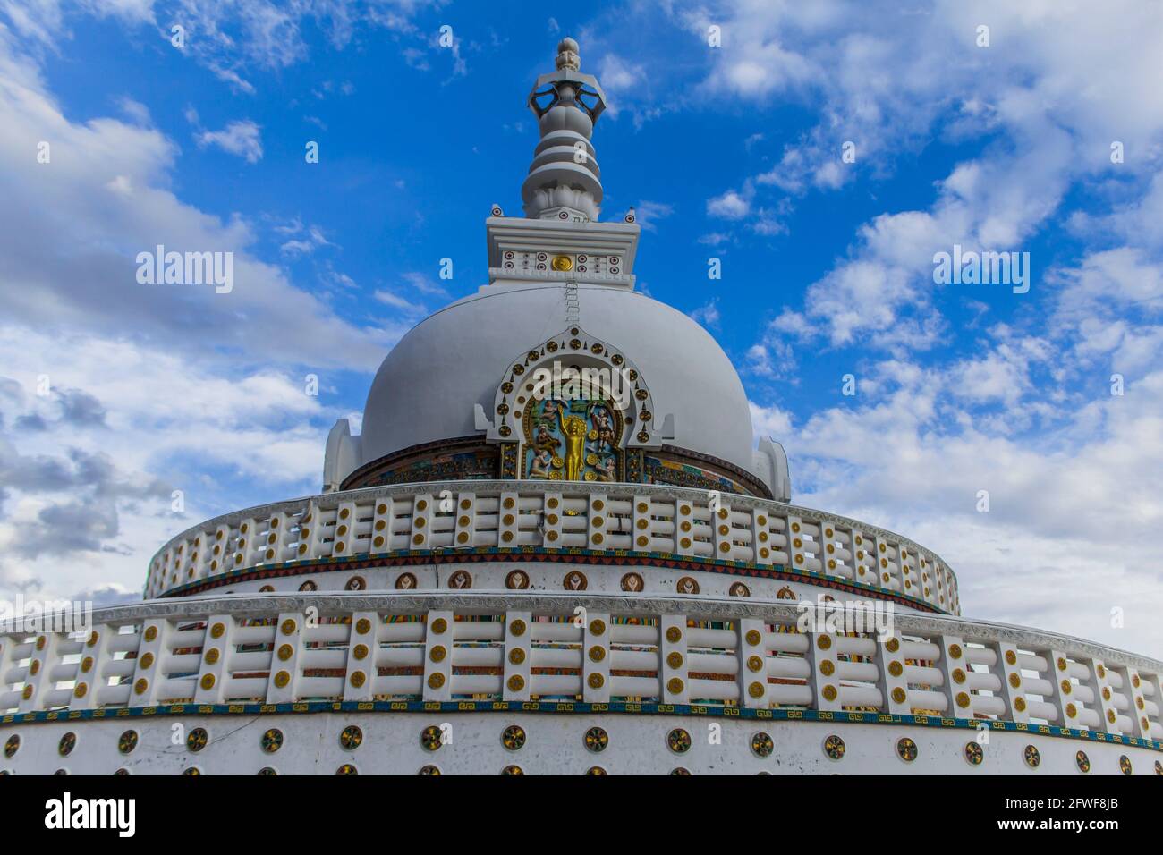 The Shanti Stupa with a cloudy backgound Stock Photo