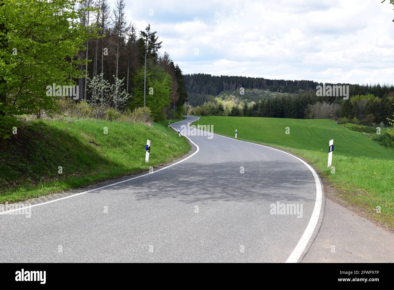 twisted Eifel road in spring Stock Photo