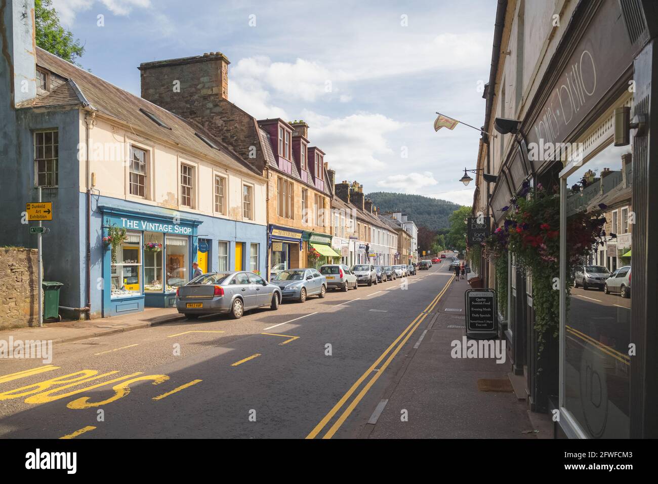Dunkeld, Scotland - August 15 2016: The quaint main shopping high street of the Scottish town and village of Dunkeld and Birnam in Perth and Kinross. Stock Photo