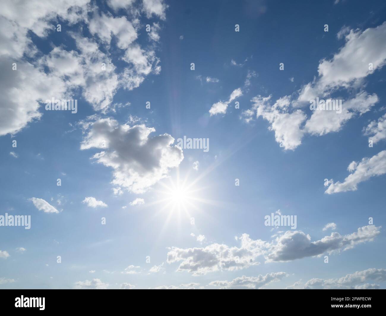 Brillant sun shining in blue sky overhead in southwest Florida USA Stock Photo