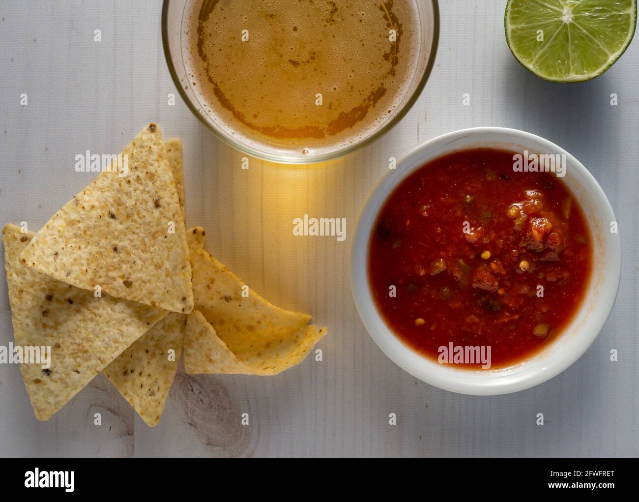 Fresh tortilla chips and beer. Stock Photo