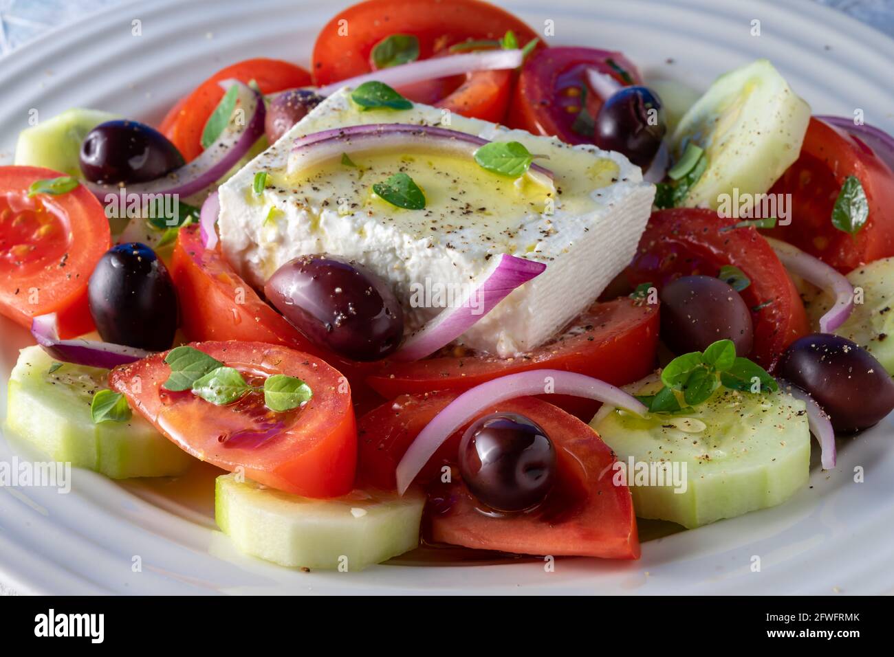 Greek salad on round plate. Stock Photo