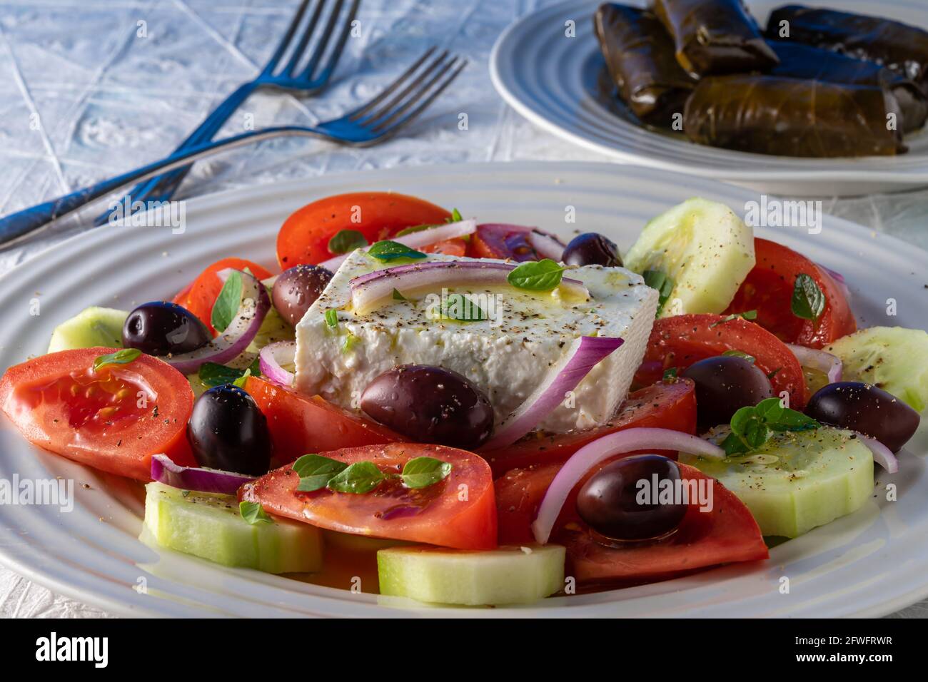 Greek salad on round plate. Stock Photo
