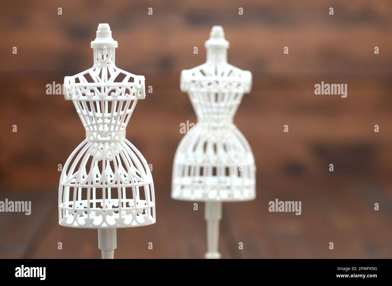 Fashion design concept, vintage mannequin stand on the wooden background. Stock Photo
