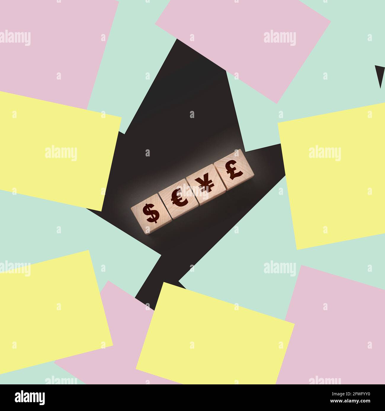 Dillar, euro, yen and pound on building blocks. wooden cubes with