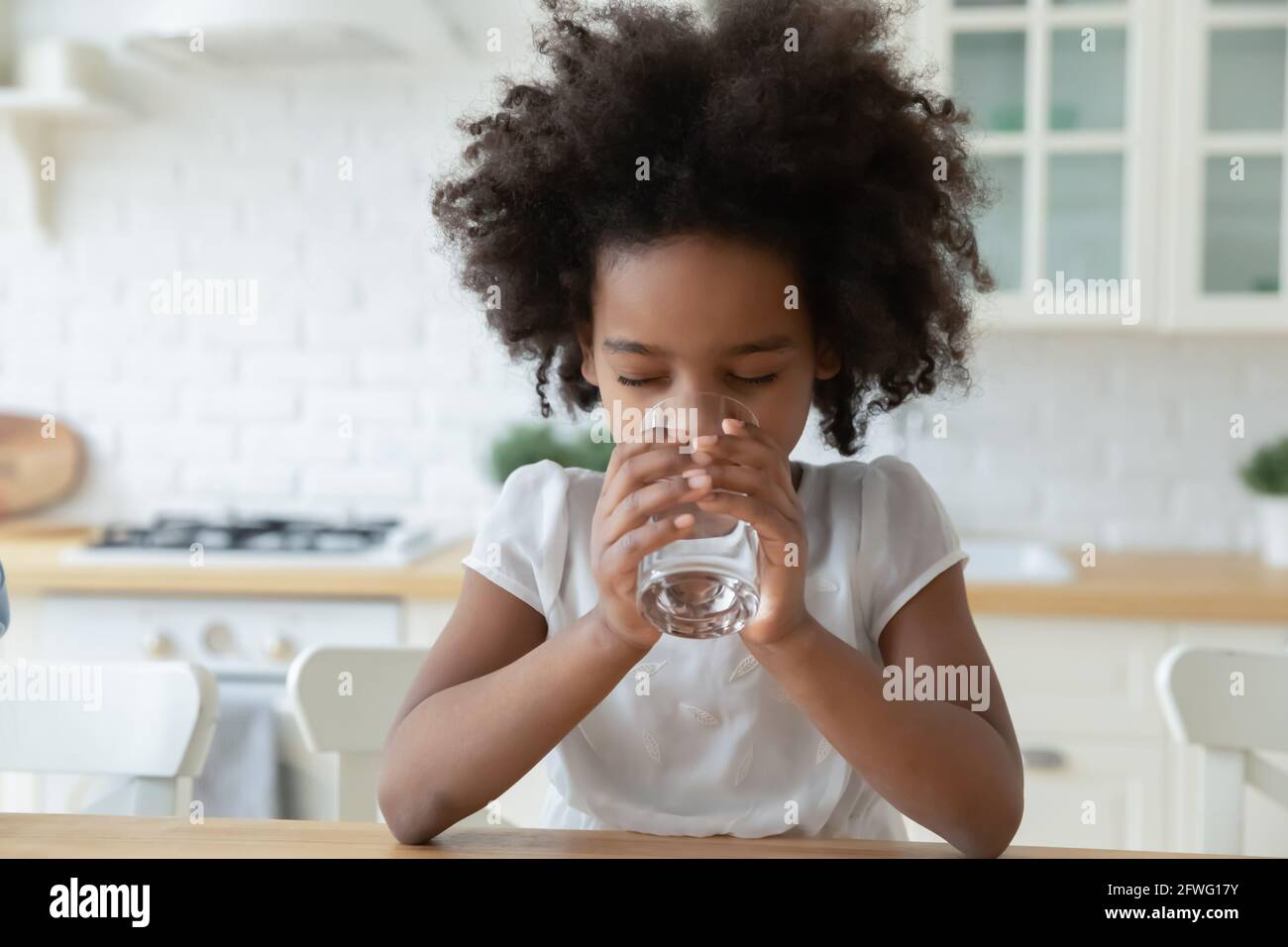 Thirsty African American child drink clean water Stock Photo Alamy