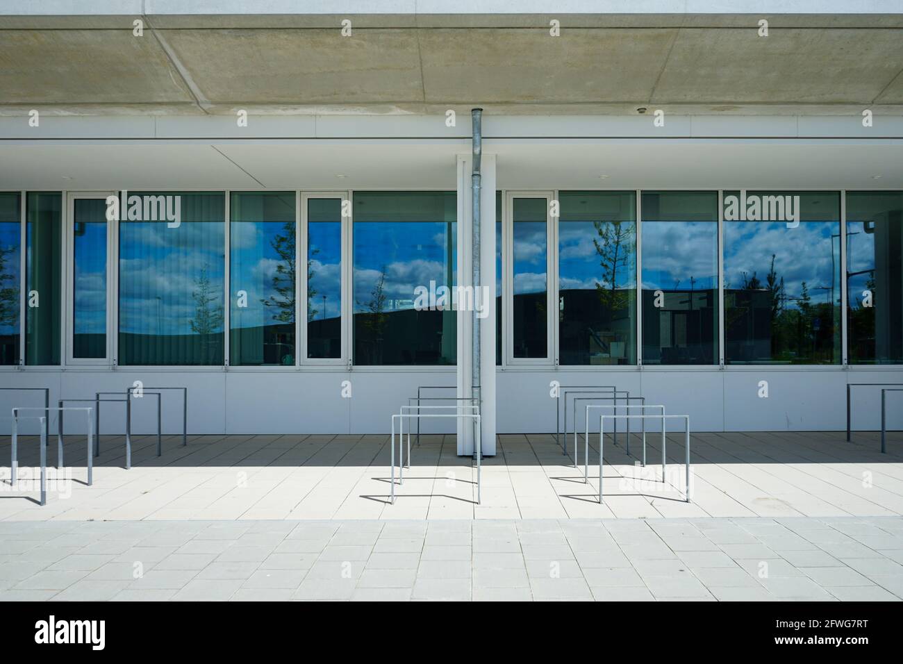 Bike racks in front of a school campus. Stock Photo