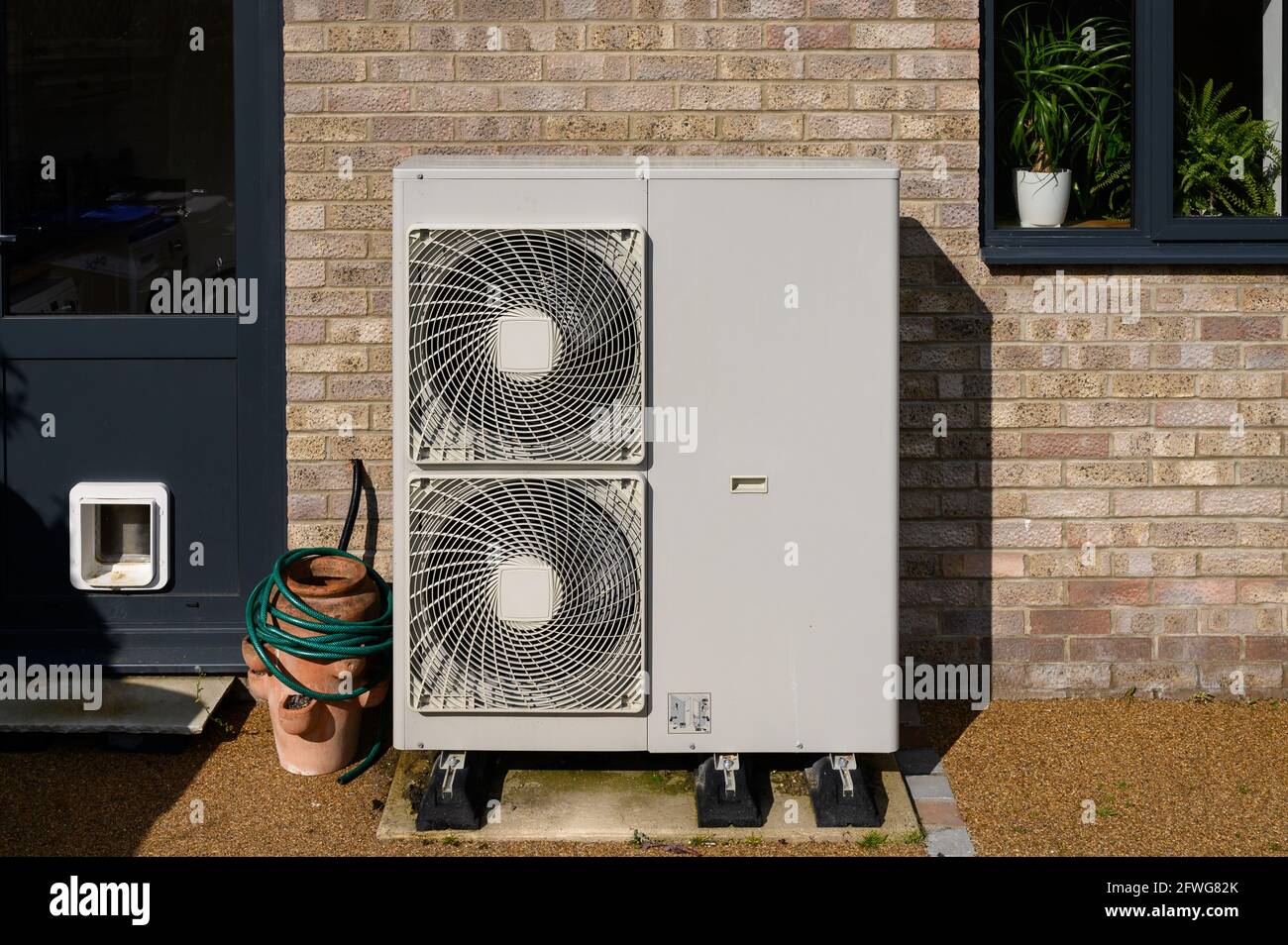 Domestic air source heat pump providing green energy in an
