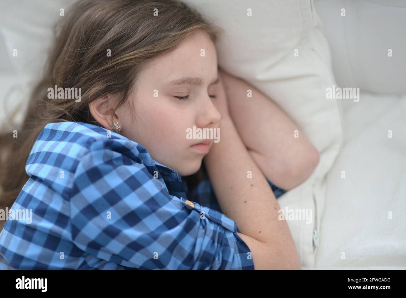 Cute little girl sleeping in bed at home Stock Photo Alamy