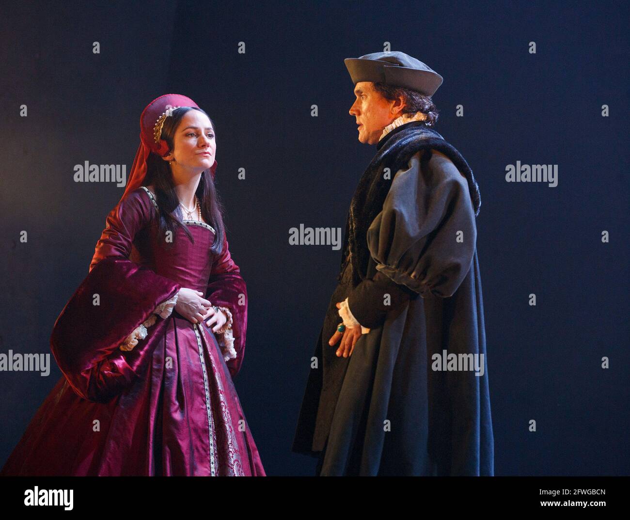 Lydia Leonard (Anne Boleyn), Ben Miles (Thomas Cromwell) in BRING UP THE BODIES by Hilary Mantel at the Royal Shakespeare Company (RSC), Aldwych Theatre, London WC2  17/05/2014  adapted for the stage by Mike Poulton  design: Christopher Oram  lighting: Paule Constable  director: Jeremy Herrin Stock Photo