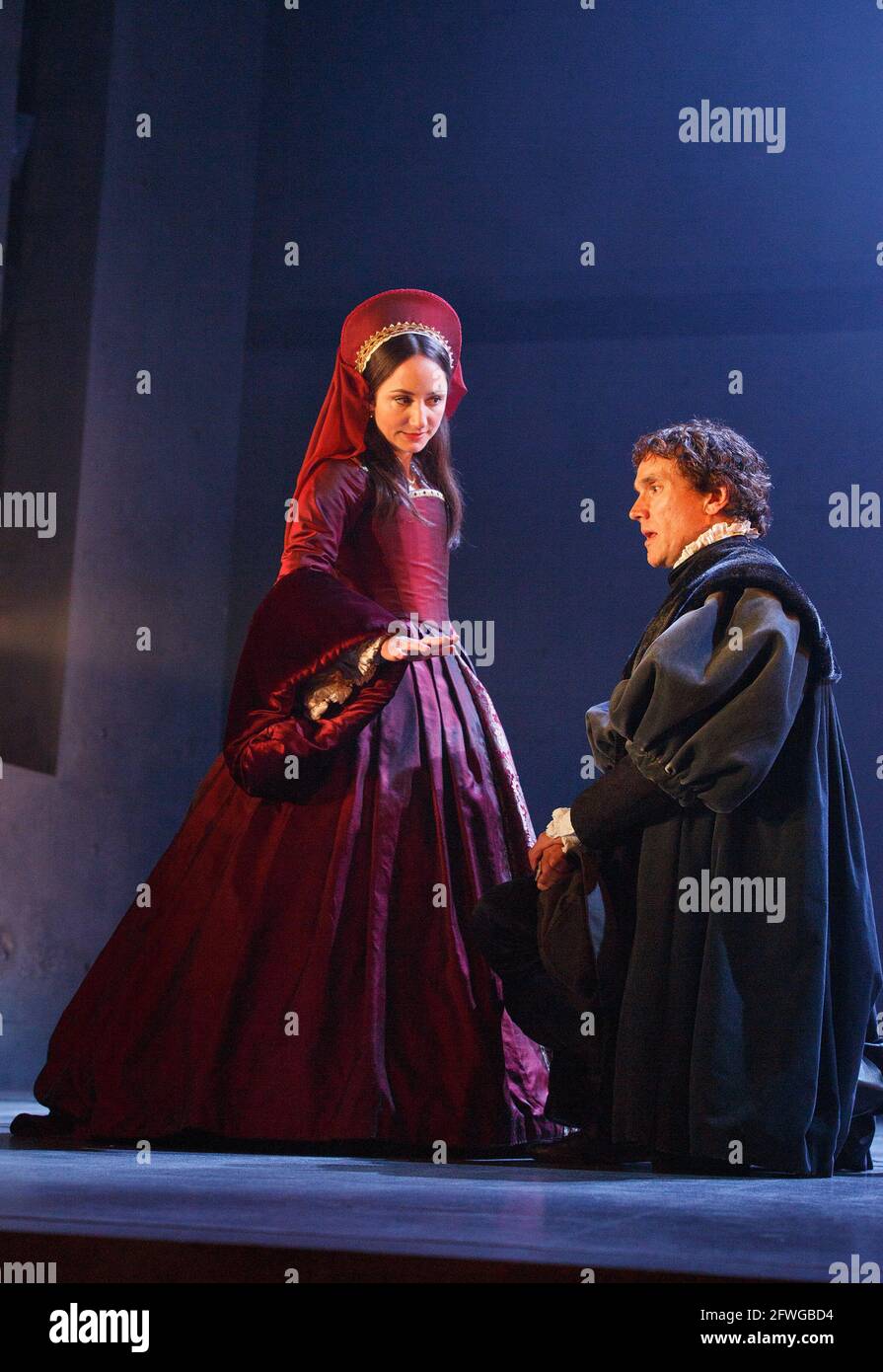 Lydia Leonard (Anne Boleyn), Ben Miles (Thomas Cromwell) in WOLF HALL by Hilary Mantel at the Royal Shakespeare Company (RSC), Aldwych Theatre, London WC2  17/05/2014  adapted for the stage by Mike Poulton  design: Christopher Oram  lighting: Paule Constable  director: Jeremy Herrin Stock Photo