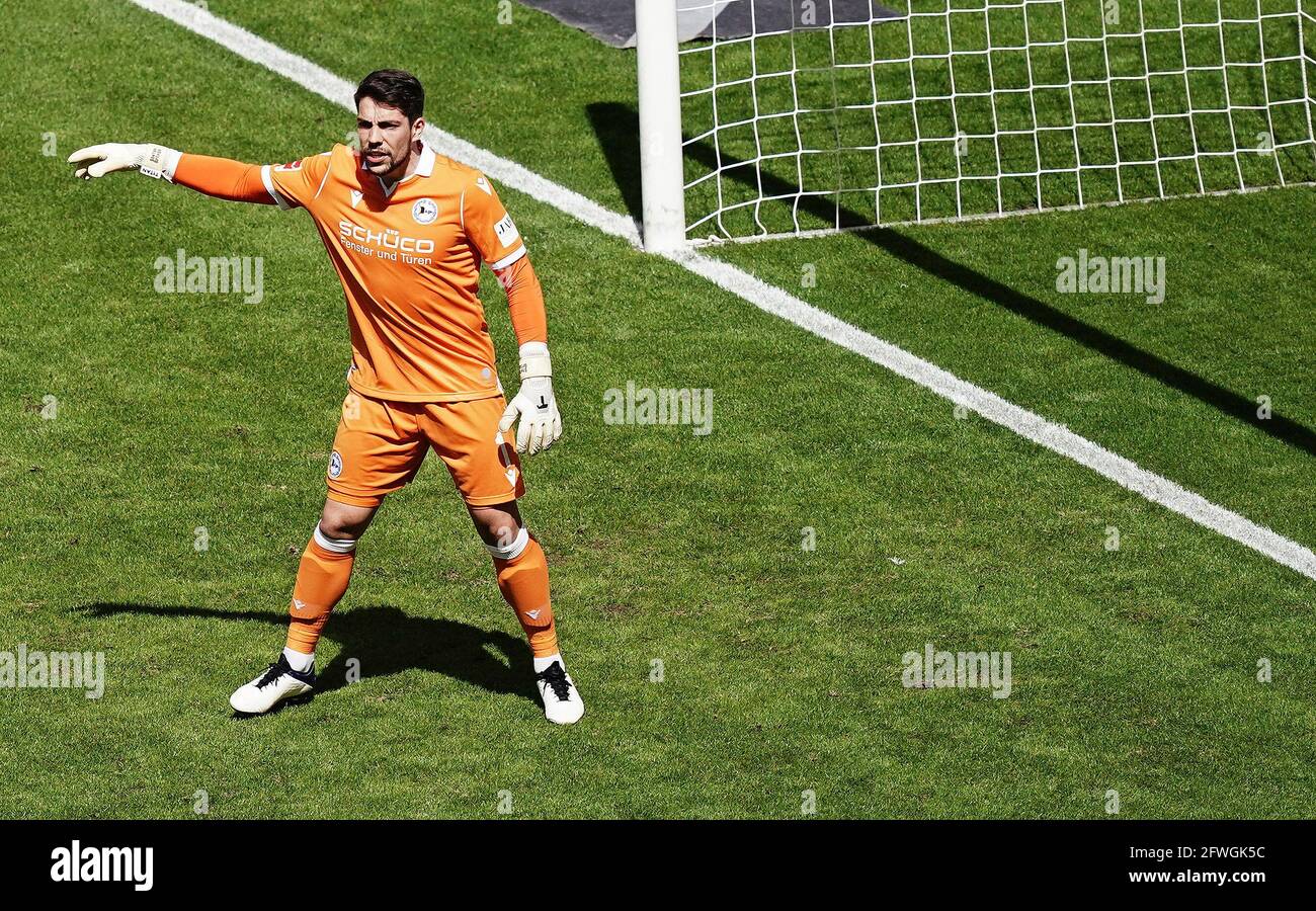 Munich's goalkeeper Stefan Ortega Moreno (R) catches the penalty shot by  Andreas Geipl of Regensburg (2-R) during the 2. Bundesliga relegation match  between Jahn Regensburg and TSV 1860 Munich at the Continental