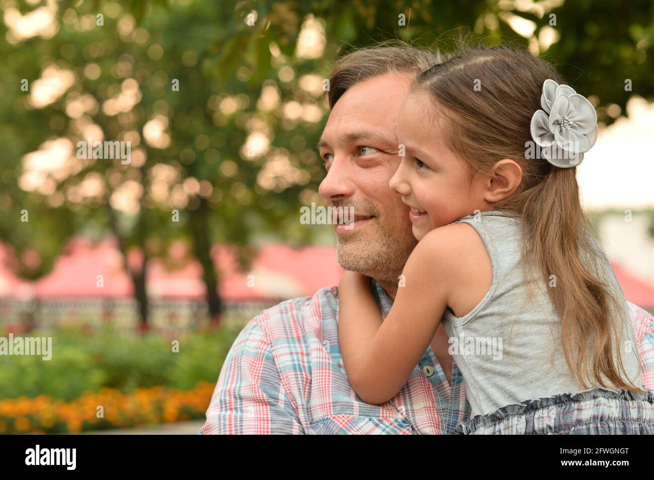 Portrait of happy father and daughter hugging outdoors Stock Photo - Alamy