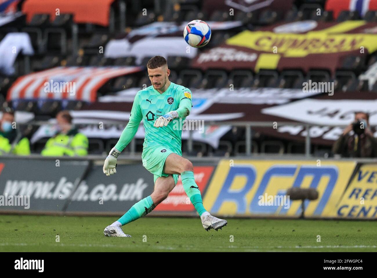 Bradley Collins #40 of Barnsley kicks the ball up field Stock Photo