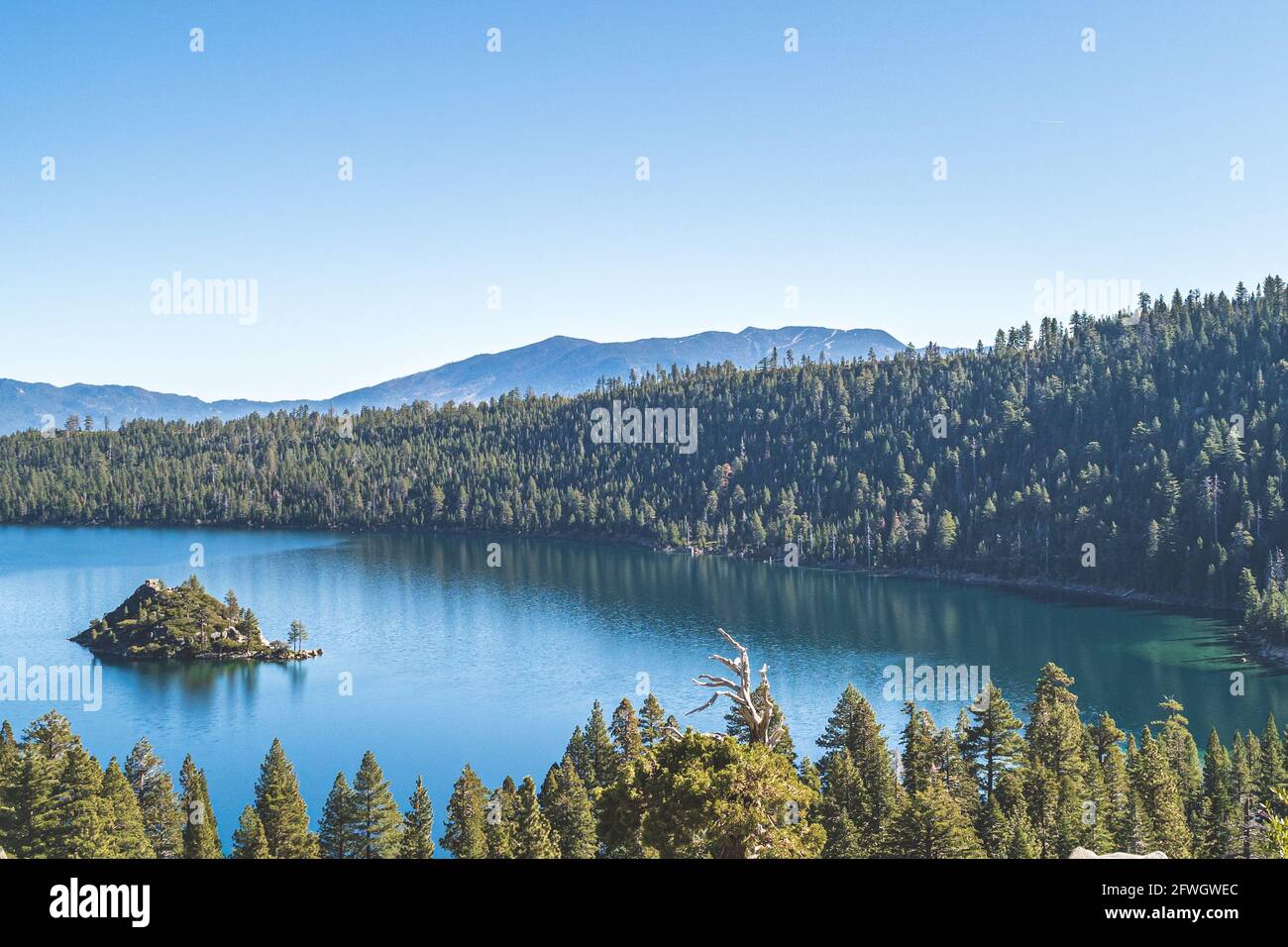 Emerald Bay, Lake Tahoe, California with view of Fannette island on clear sunny day. Blue water with reflections Stock Photo