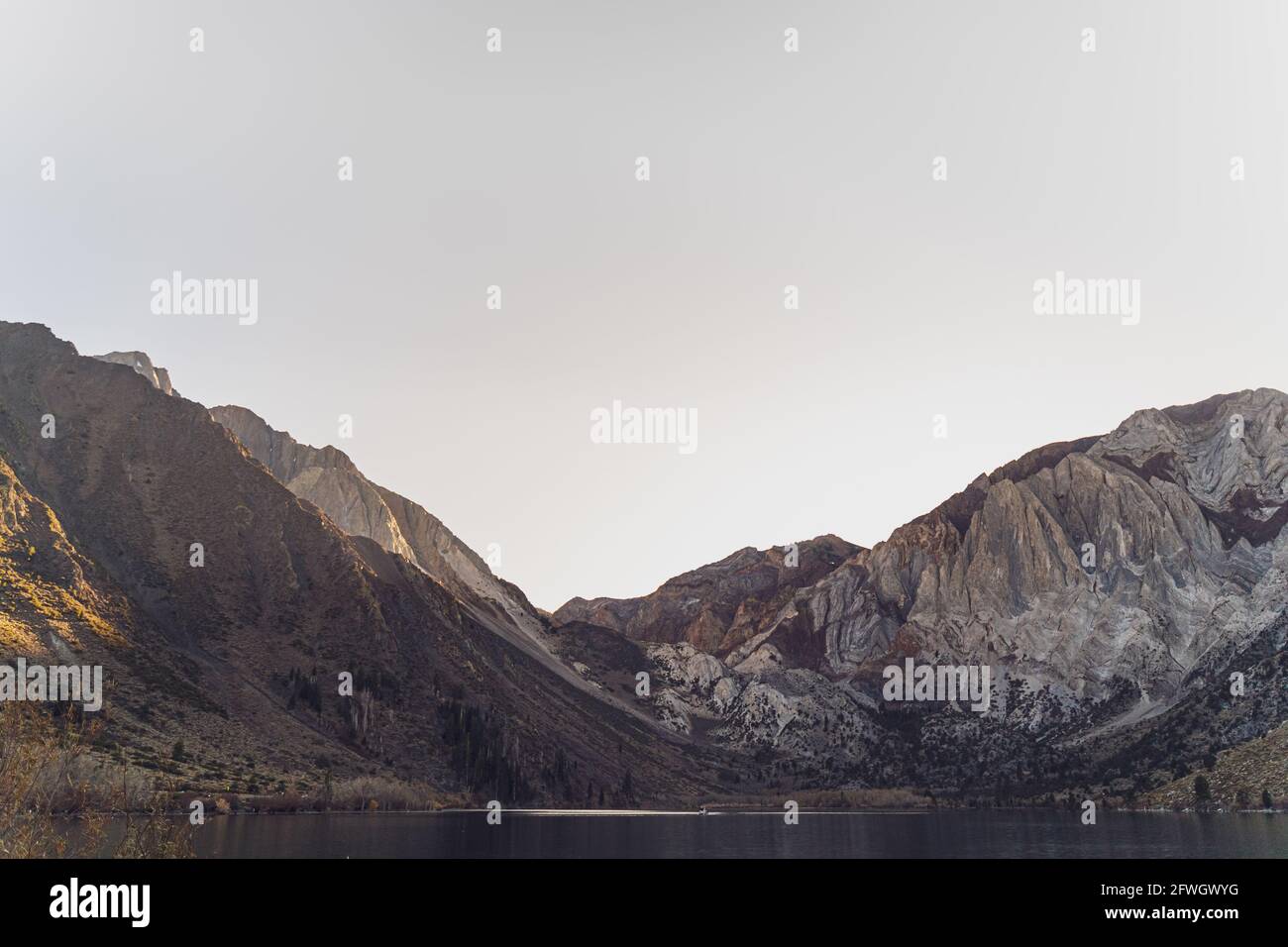 Convict Lake view of Sherwin range of Sierra Nevada Mountains on a clear day at sunset Stock Photo