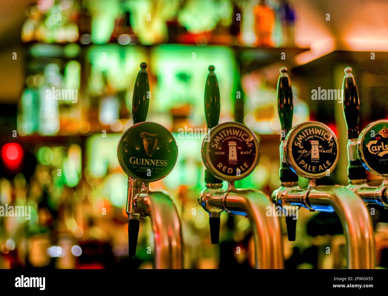 Draft beer dispensers on a bar Stock Photo - Alamy