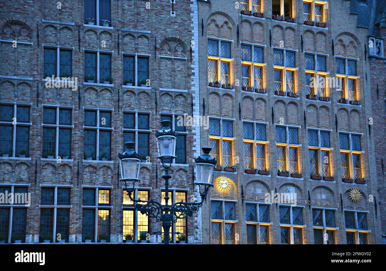Historic Gothic style building facade with brick and stone walls and ...