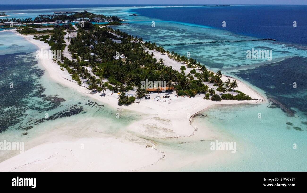 Maldives resort island drone aerial view, Indian ocean atoll nature beach  and palm forest, leisure tourist luxury vacation Stock Photo - Alamy