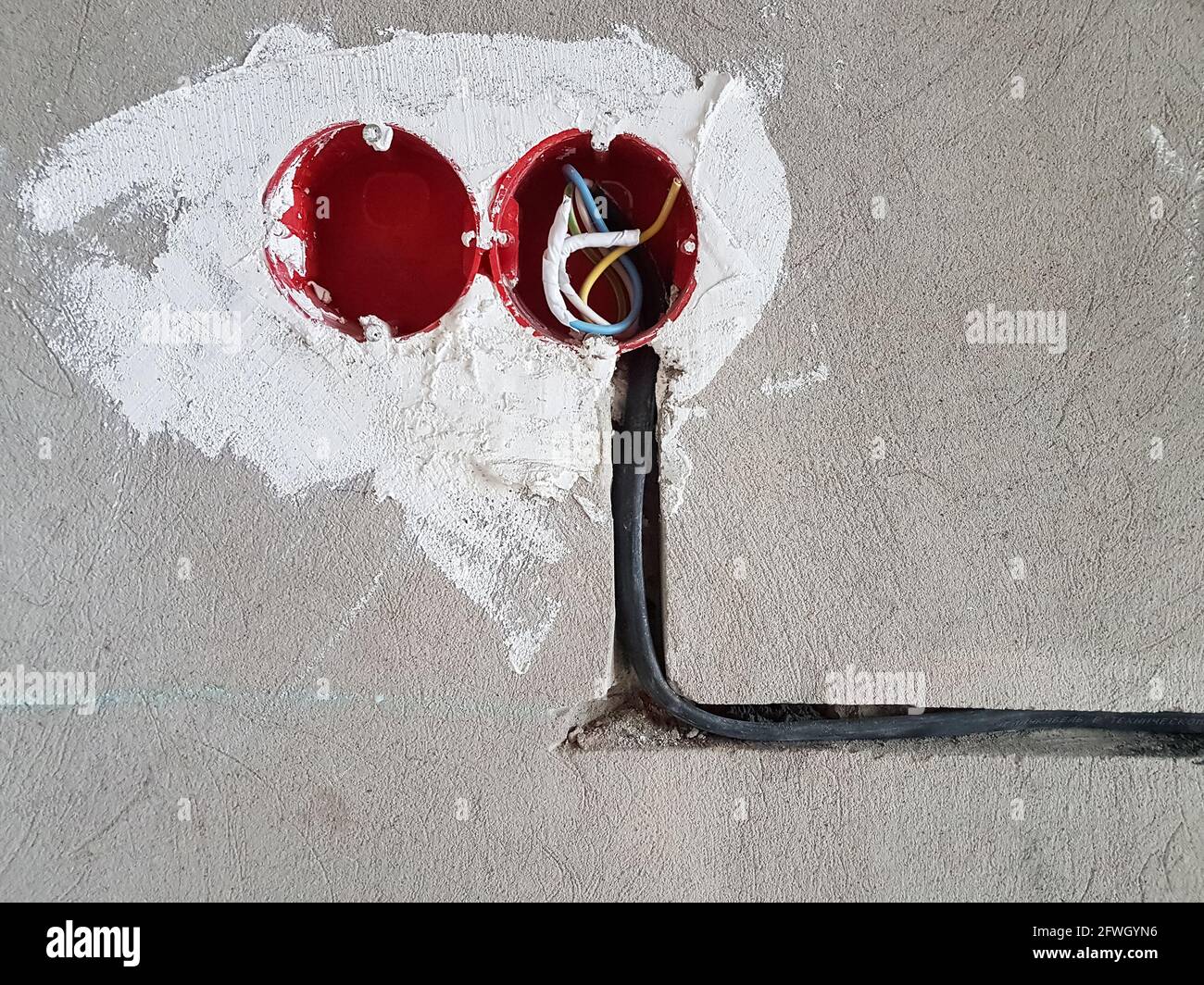 Electrical wires with cables at home repair. New electrical outlets