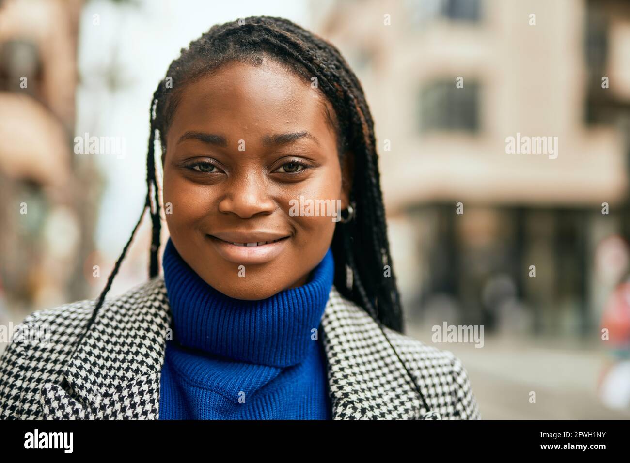 Young african american businesswoman smiling happy standing at the city ...