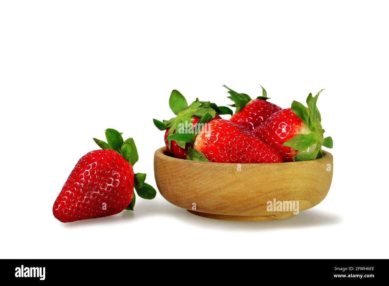 Fresh strawberries in wooden bowl isolated on white background Stock ...