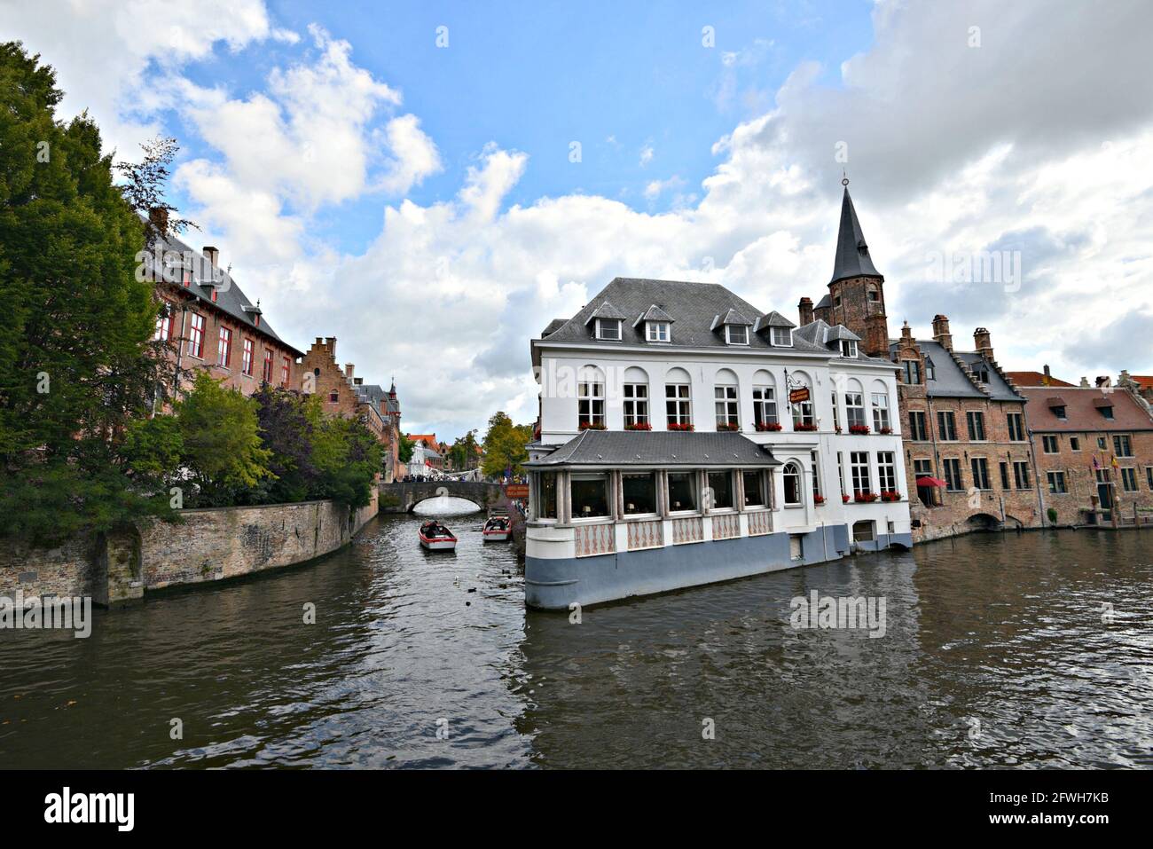 Scenic view of Duc De Bourgogne, a historic Victorian Hotel and Restaurant on the banks of Dijver Canal in the historic center of Bruges, Belgium. Stock Photo