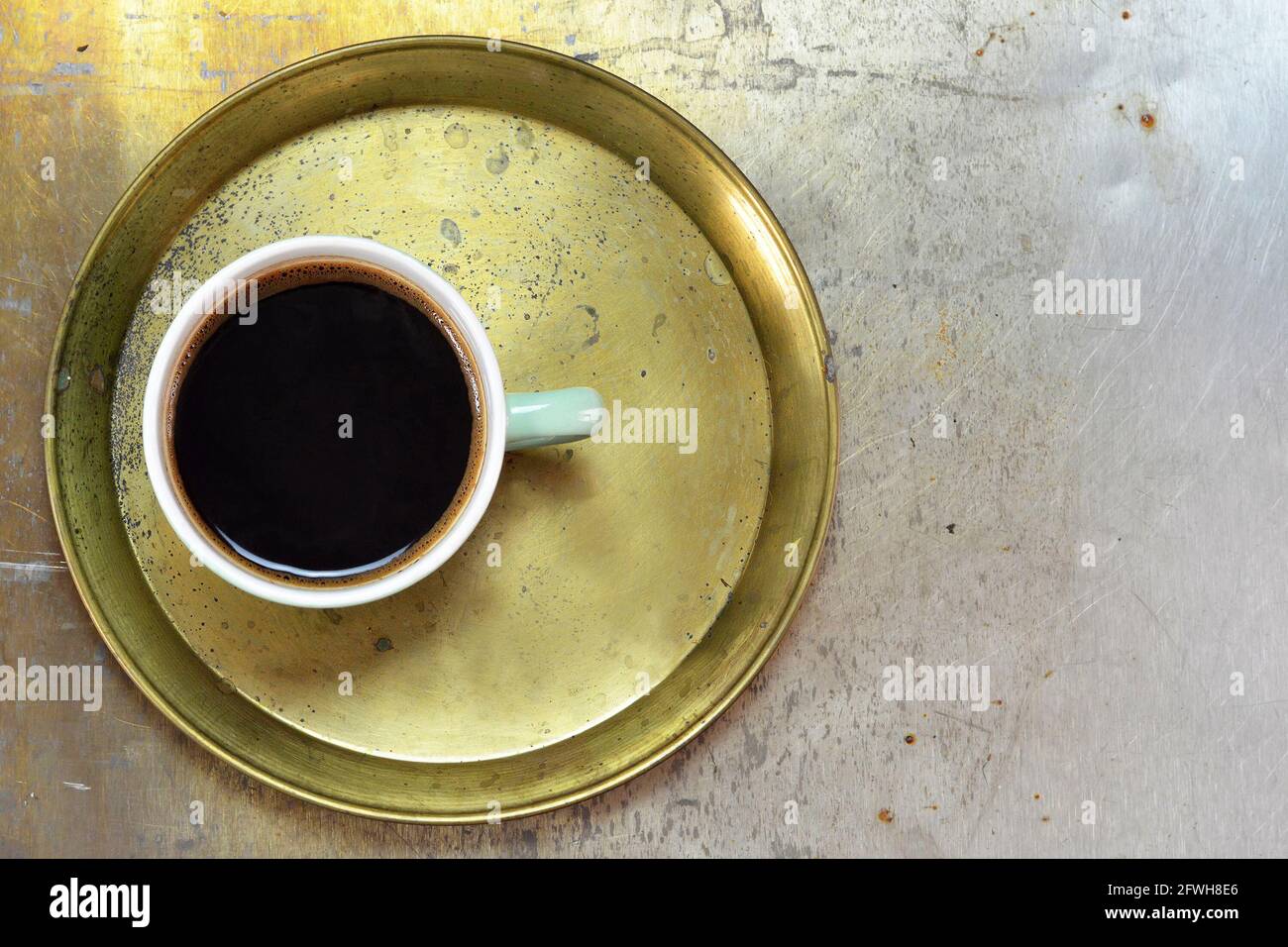 Cup of coffee on old tray Stock Photo