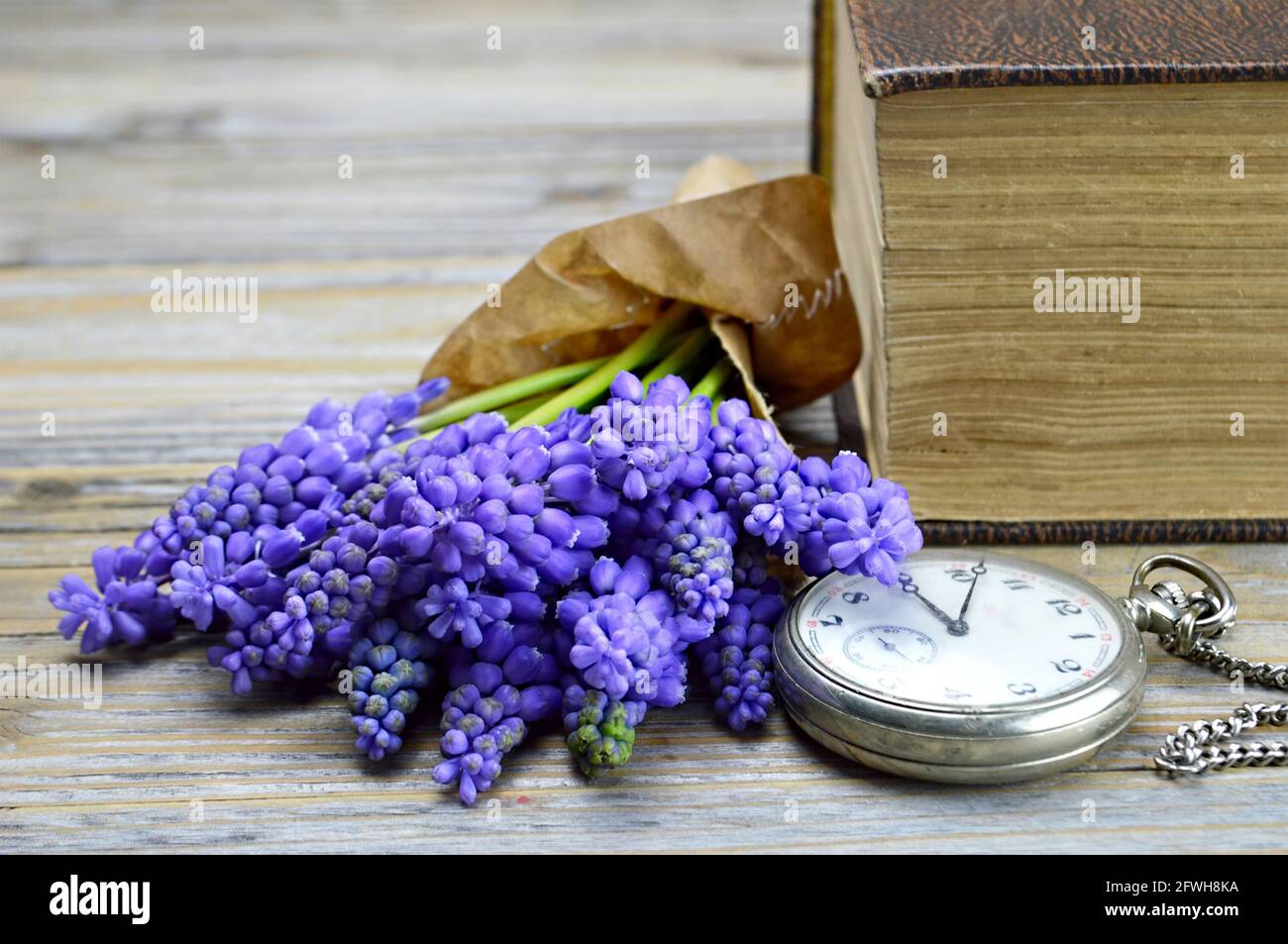 Fathers Day flowers and vintage pocket watch Stock Photo