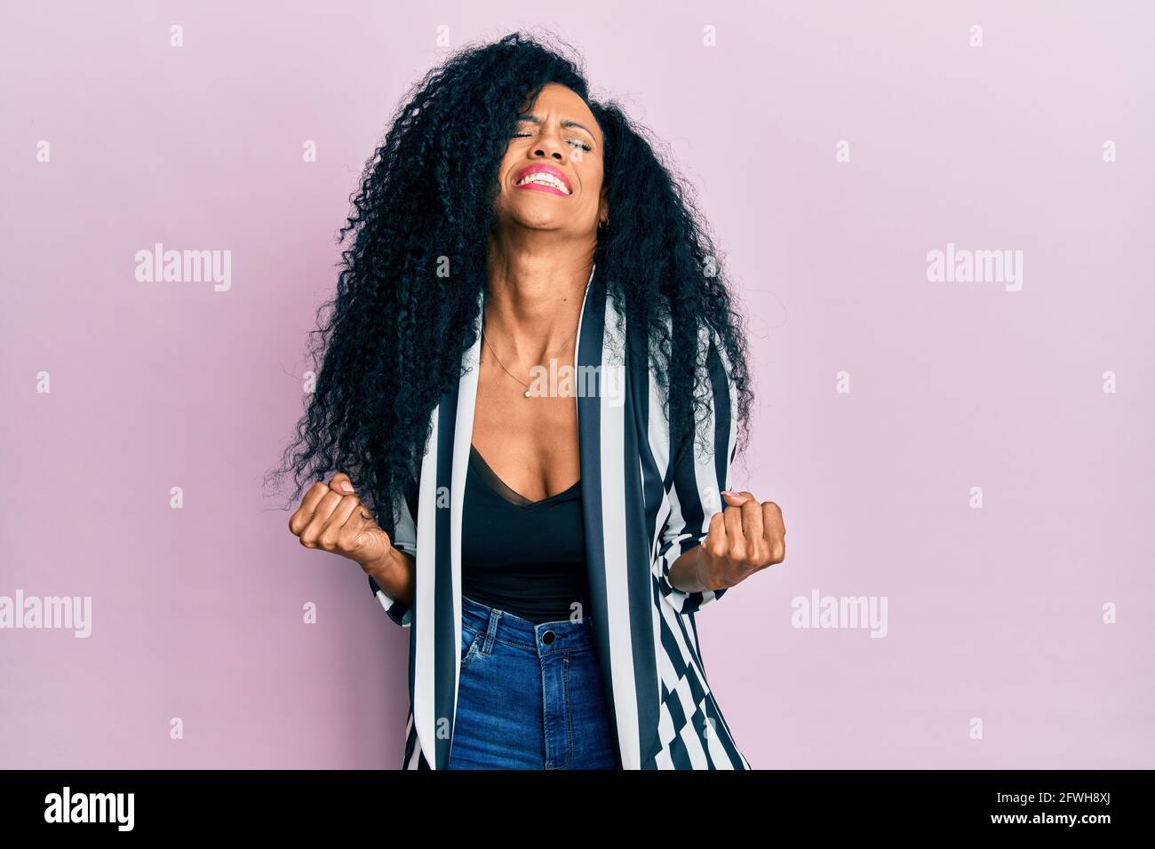 Middle age african american woman wearing casual clothes very happy and ...