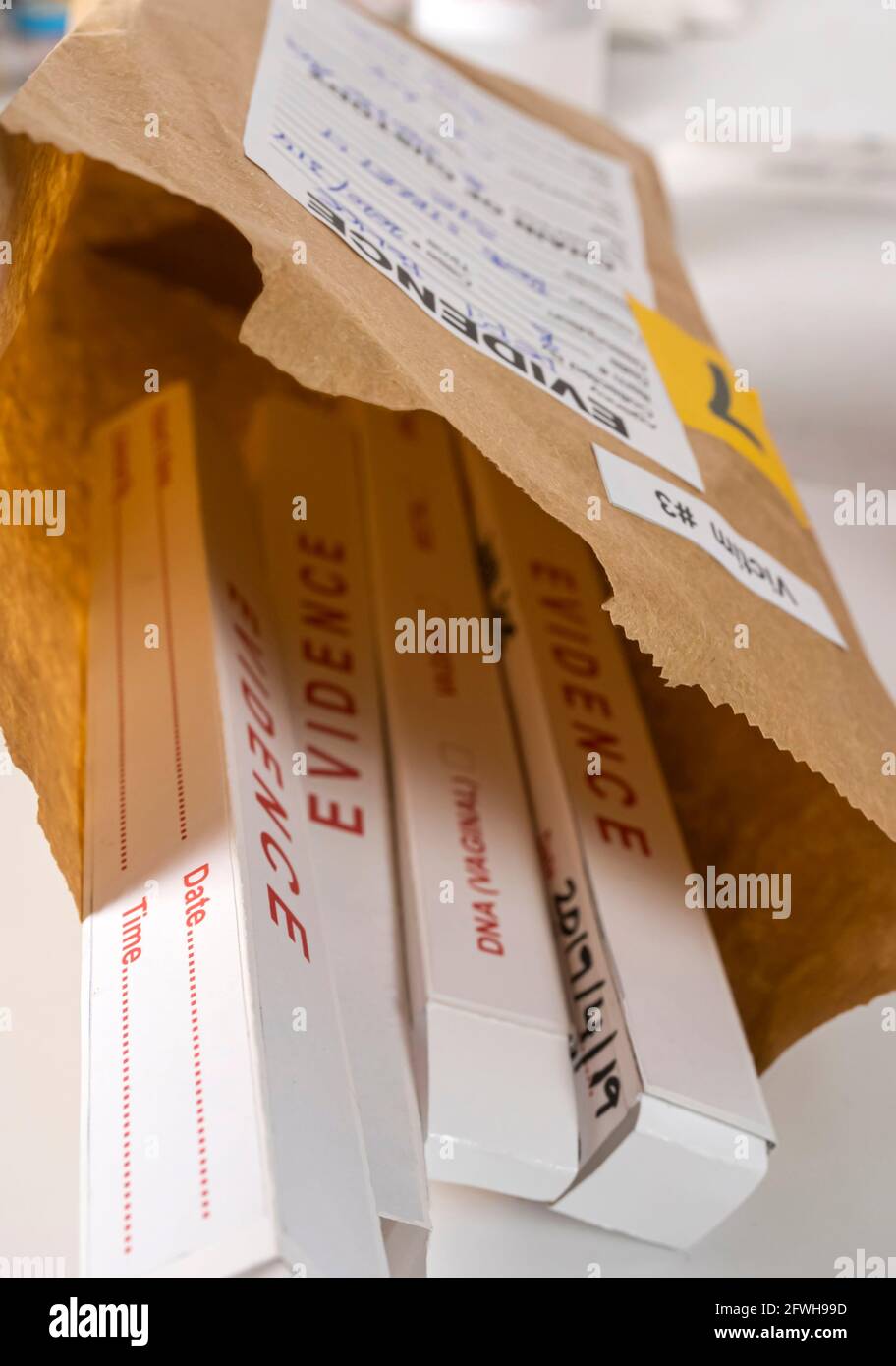 Several boxes of swab evidence in the crime lab for analysis, conceptual image. Stock Photo