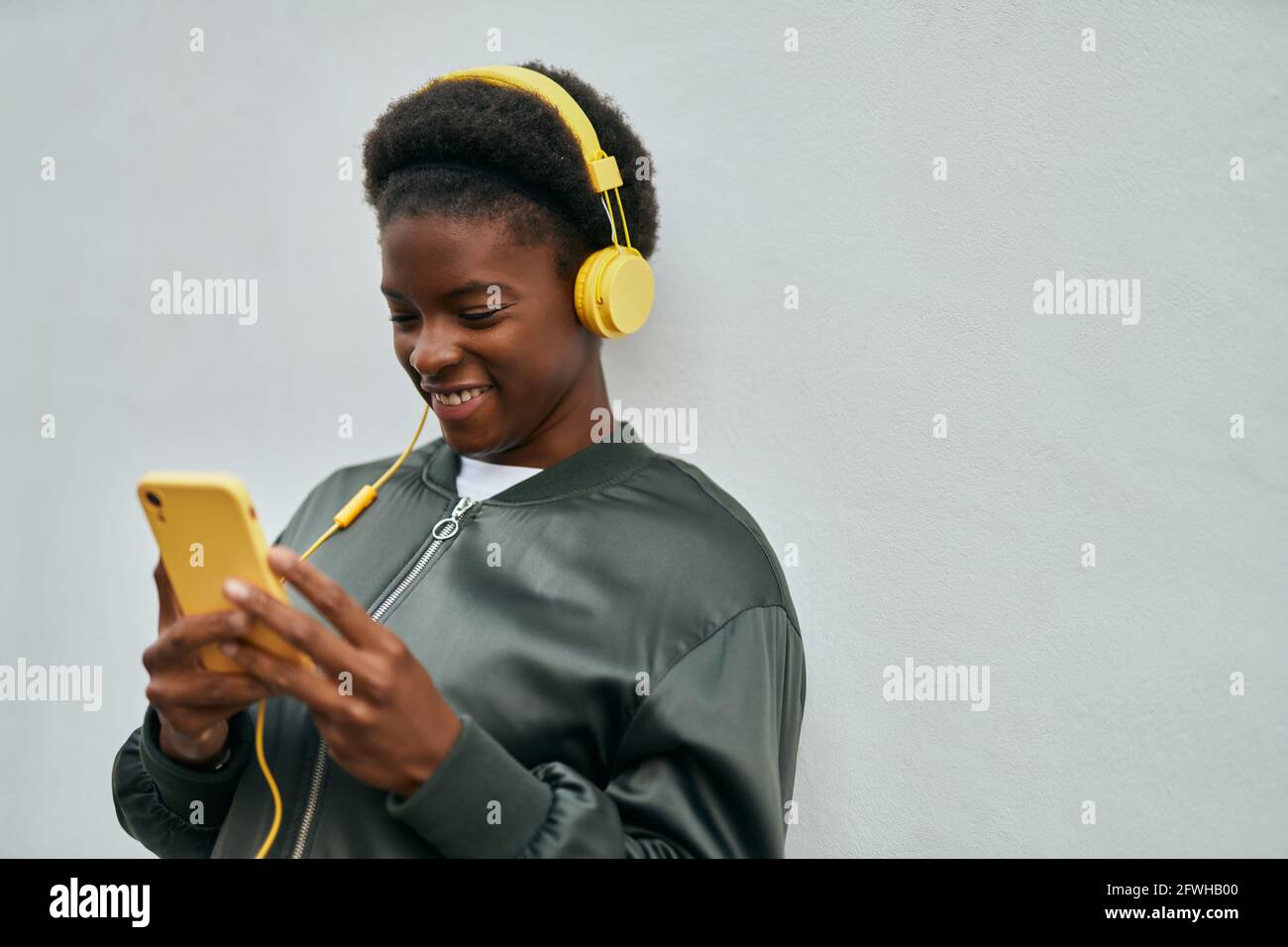 Young african american girl smiling happy using smartphone and ...