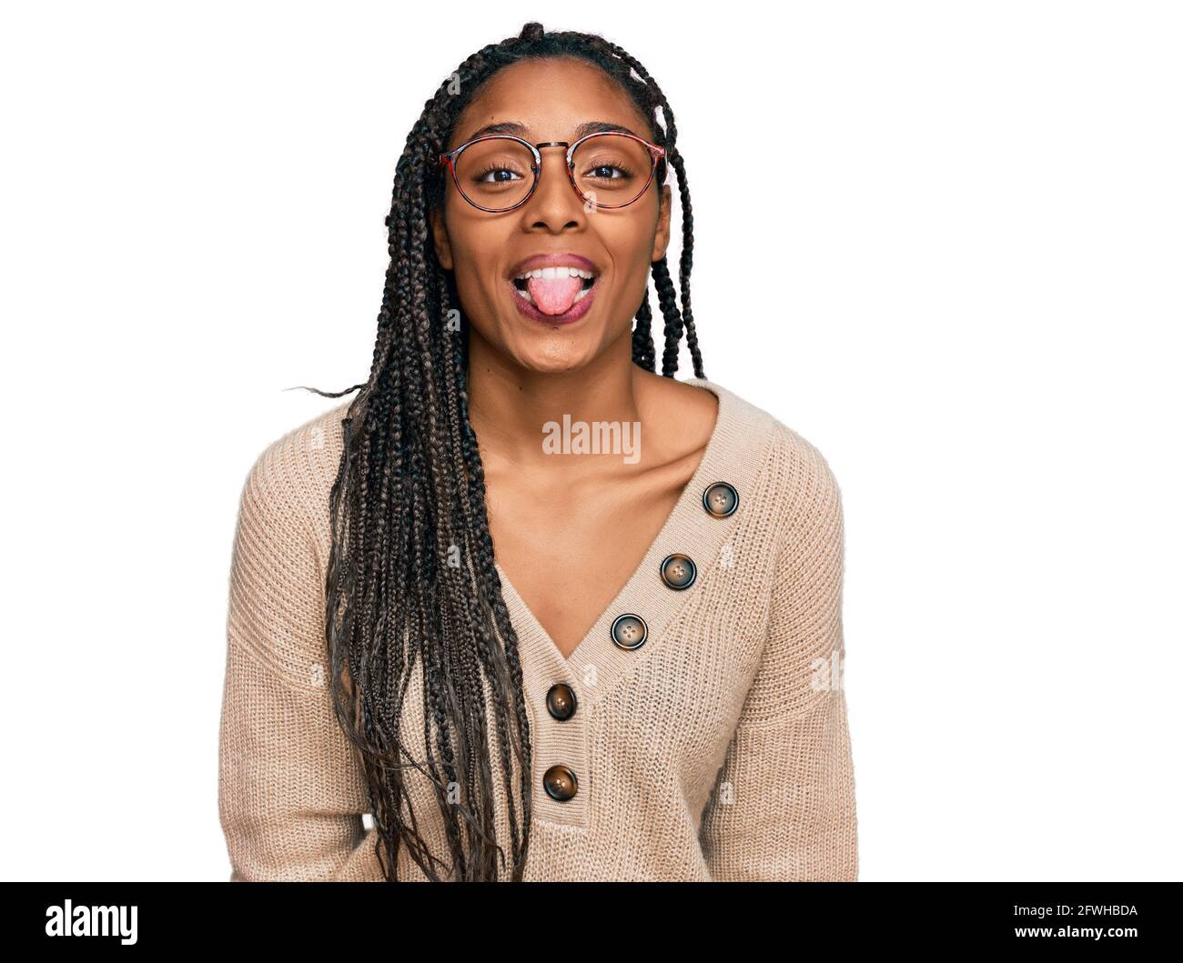 African american woman wearing casual clothes sticking tongue out happy ...