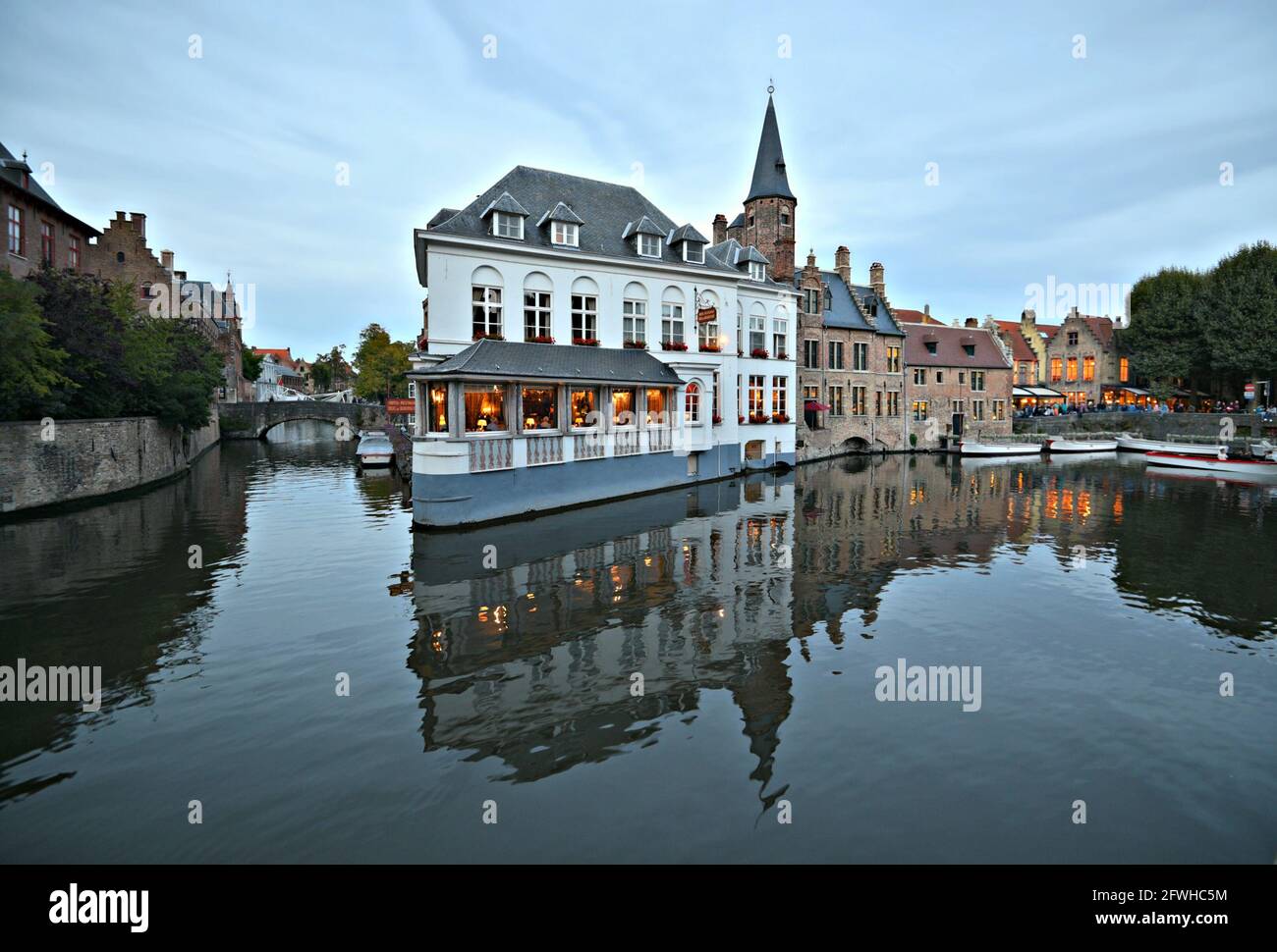Scenic view of Duc De Bourgogne, a historic Victorian Hotel and Restaurant on the banks of Dijver Canal in the historic center of Bruges, Belgium. Stock Photo