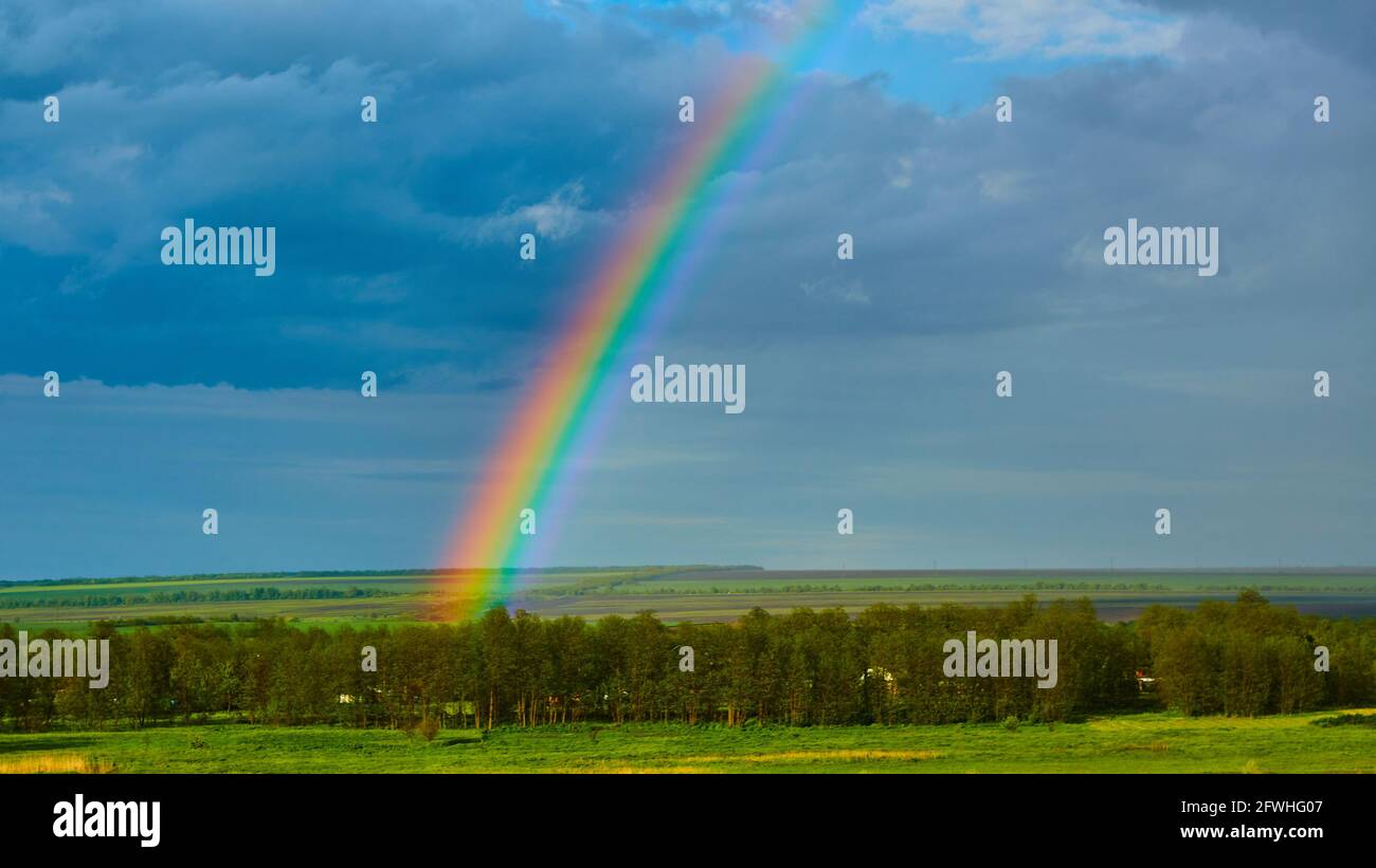 The Rainbow over Rural Landscape after Thunderstorm Stock Photo - Alamy
