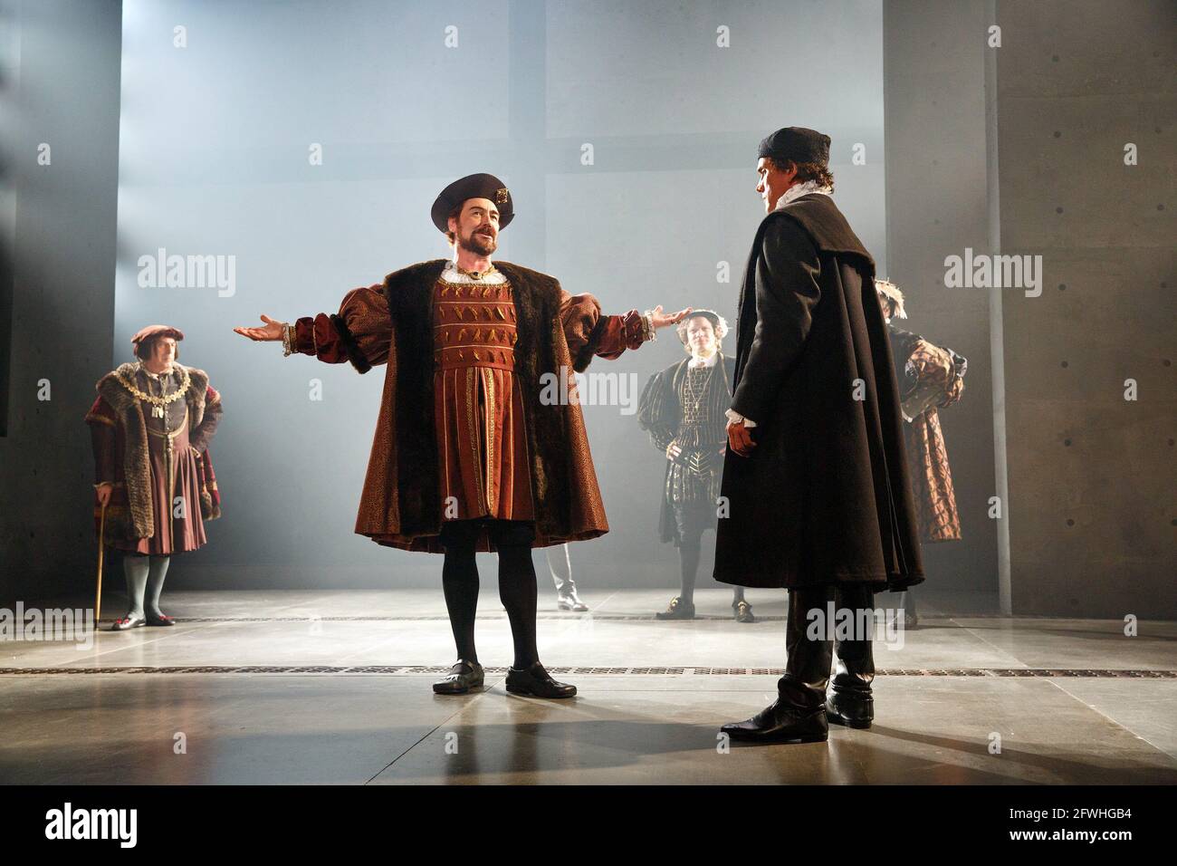 l-r: Nathaniel Parker (King Henry VIII), Ben Miles (Thomas Cromwell) in WOLF HALL by Hilary Mantel at the Royal Shakespeare Company (RSC), Aldwych Theatre, London WC2  17/05/2014 adapted for the stage by Mike Poulton  design: Christopher Oram  lighting: Paule Constable  director: Jeremy Herrin Stock Photo