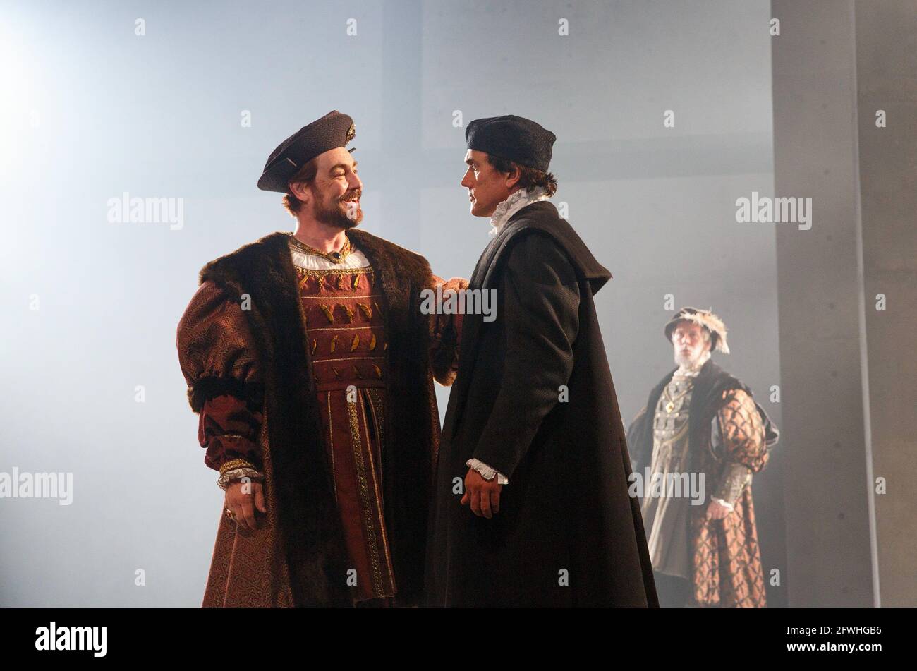 l-r: Nathaniel Parker (King Henry VIII), Ben Miles (Thomas Cromwell) in WOLF HALL by Hilary Mantel at the Royal Shakespeare Company (RSC), Aldwych Theatre, London WC2  17/05/2014 adapted for the stage by Mike Poulton  design: Christopher Oram  lighting: Paule Constable  director: Jeremy Herrin Stock Photo