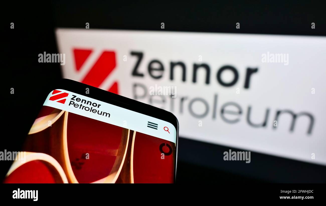 Cellphone with website of British oil and gas company Zennor Petroleum Ltd. on screen in front of business logo. Focus on top-left of phone display. Stock Photo