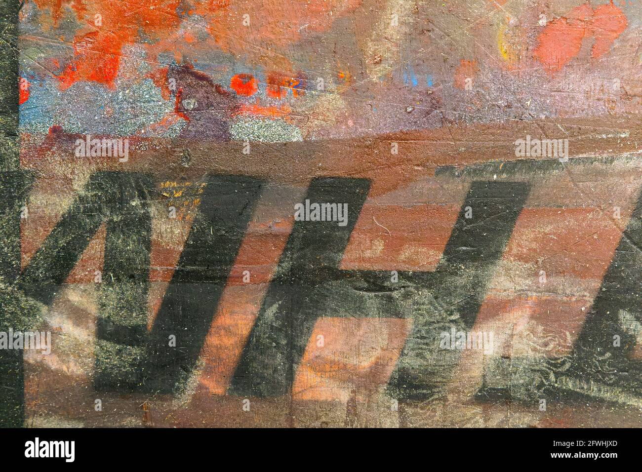 Black letters on a brightly colored wall Stock Photo